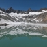 Der Grosser Diamantstock und Hiendertelltihorn spiegeln sich im Schmelzwassersee vom Grubengletscher.